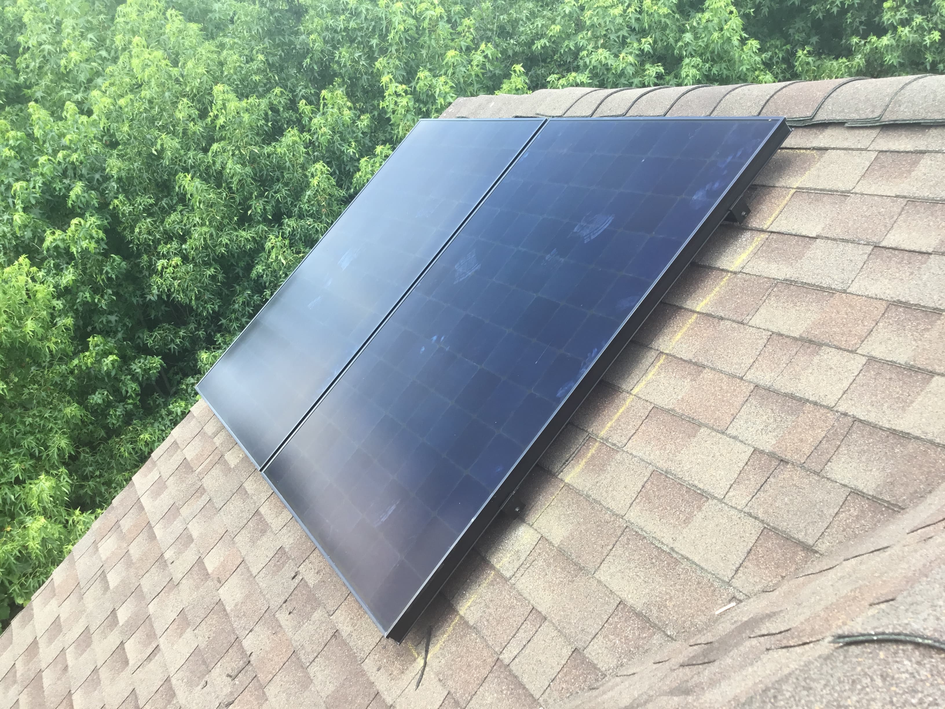 Drone scanning a residential roof to size a solar array precisely